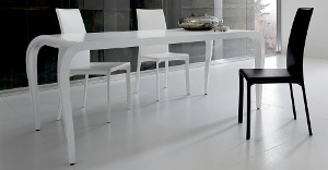 White tables with blackand white chairs around